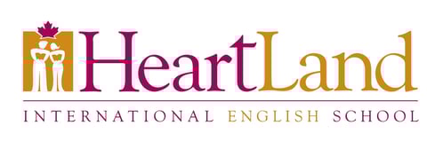 Heartland International English School logo with maple leaf icon and gold and purple text