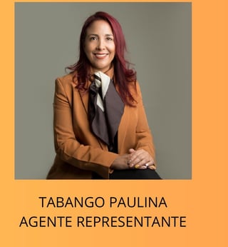 Professional headshot of Tabango Paulina, wearing a tan blazer and tie, smiling at the camera against a gray background